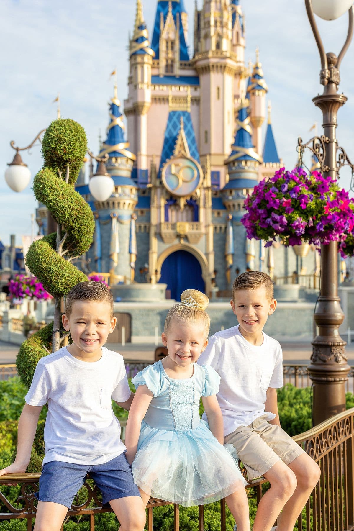 Family posing in front of Cinderella Castle at Magic Kingdom