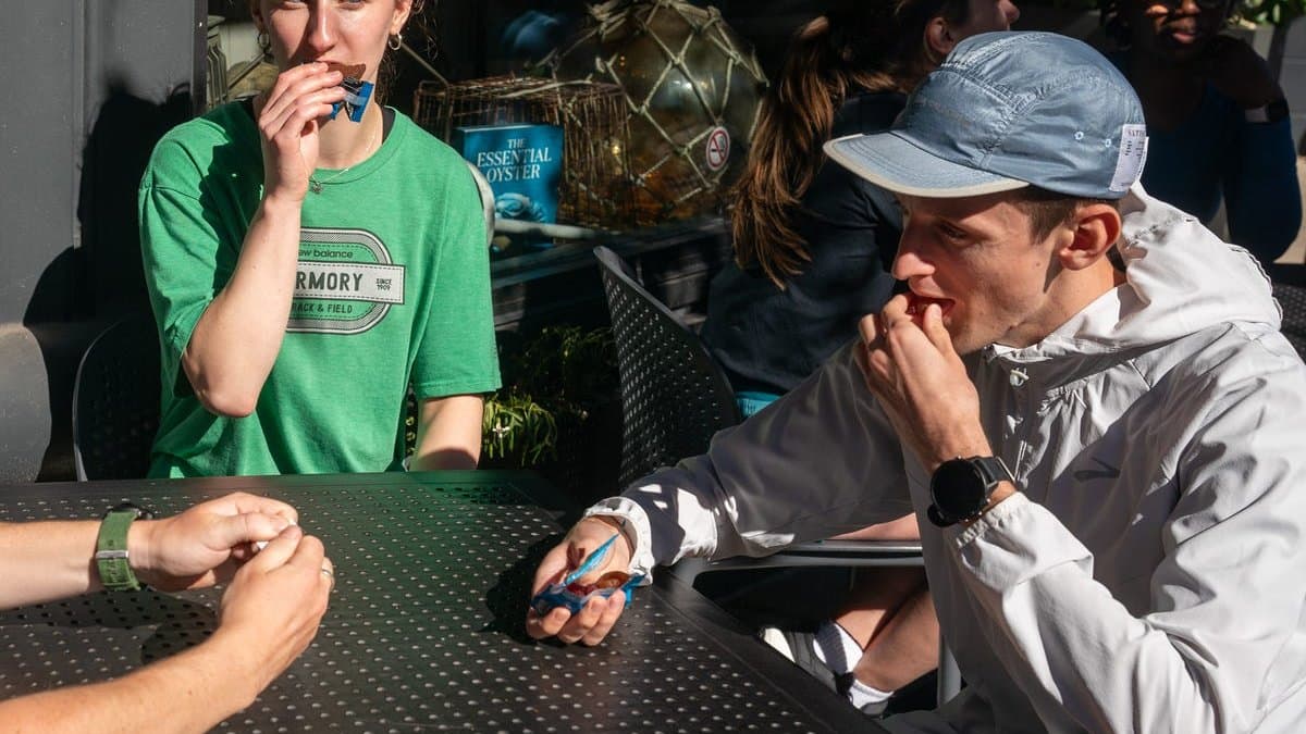 Group of runners at a carb-loading dinner — the night before race day