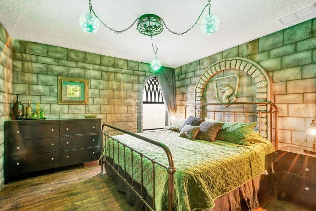The Emerald Serpent Suite — dark, moody, dramatic. Elphaba's room.